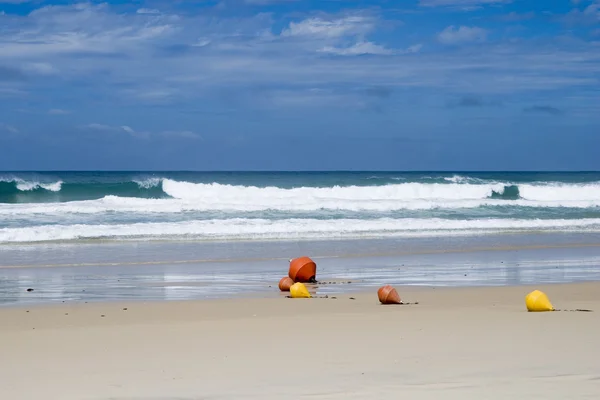 Australian beach with signal buoys — Stock Photo, Image