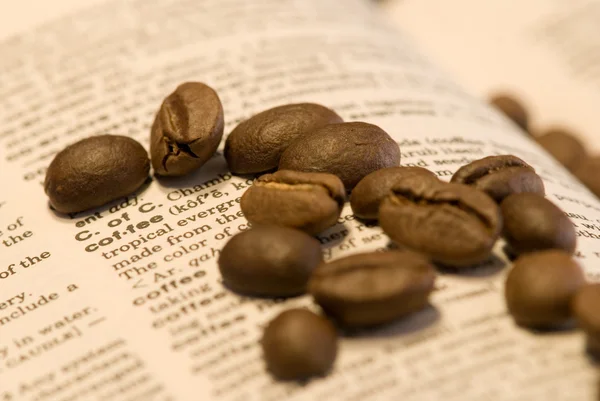 stock image Coffee beans on book