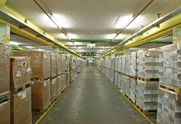stock image Storehouse with shrink-wraped palettes