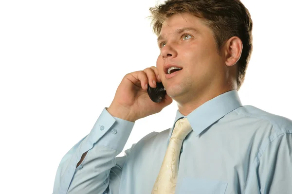O homem de negócios falando por um telefone móvel — Fotografia de Stock