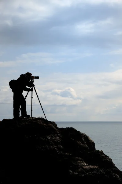 The photographer on mountain — Stock Photo, Image