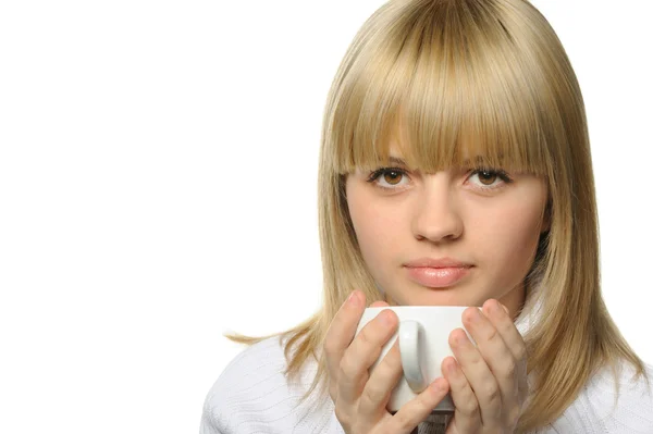 The young girl drinks coffee — Stock Photo, Image