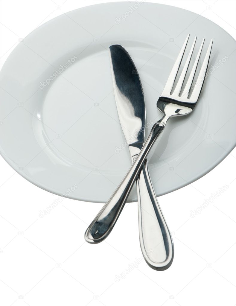 Knife and fork on a plate Stock Photo by ©galdzer 1524651