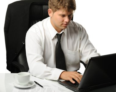 The young businessman on a workplace clipart