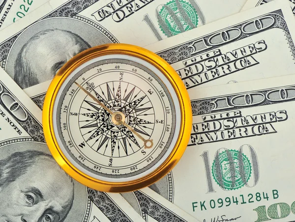 Dollar und Kompass — Stockfoto
