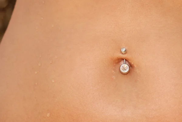 Piercing in a navel — Stock Photo, Image