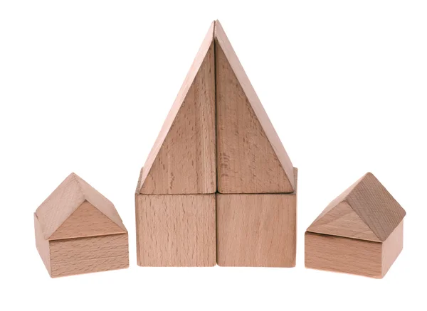 Casas de brinquedo. Cubos de madeira combinados no — Fotografia de Stock