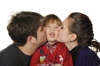 Mum and the daddy kiss the son. clipart