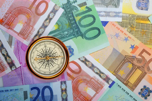 Евро и компас — стоковое фото