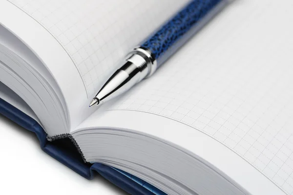 Pen en een notitieboekje — Stockfoto