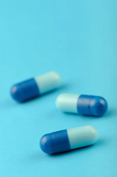 Set capsules on blue background — Stock Photo, Image
