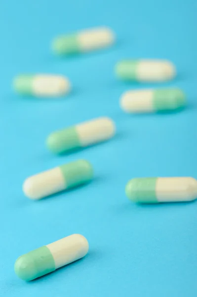Set capsules on blue background — Stock Photo, Image