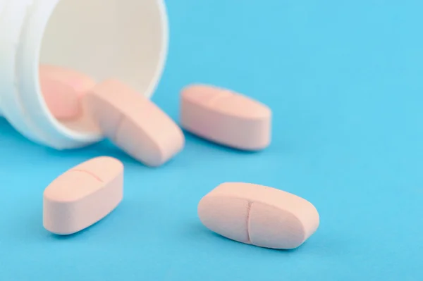 Pink tablets in white plastic packing — Stock Photo, Image