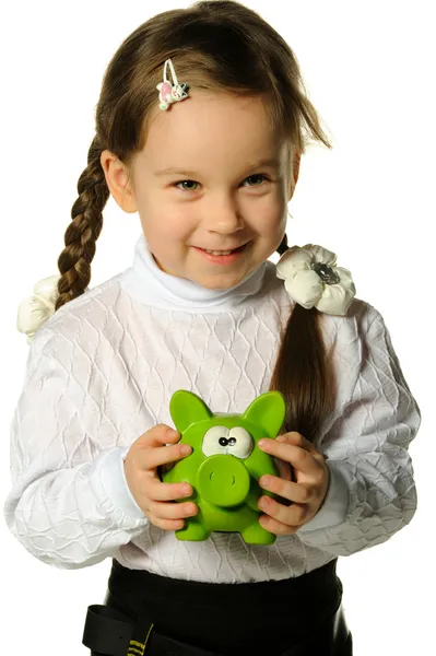 The little girl with a money box - a pig — Stock Photo, Image