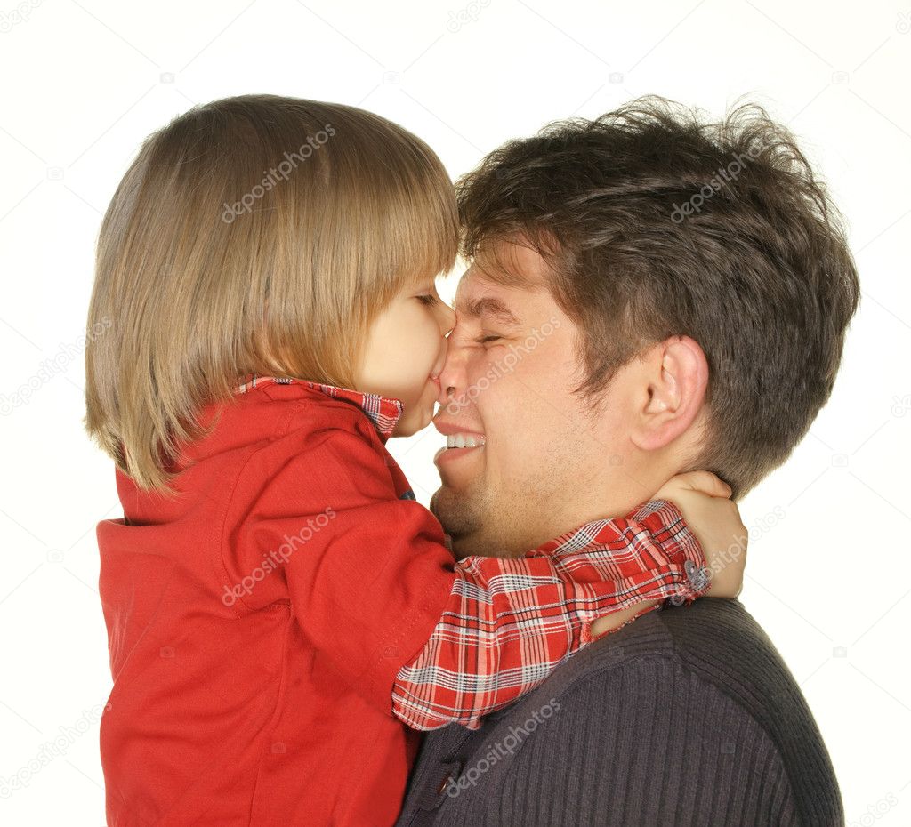 The son kisses the daddy