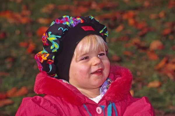 Little girl in autumn dress — Stock Photo, Image