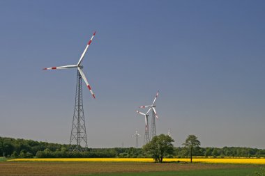 Wind power station with rape field clipart