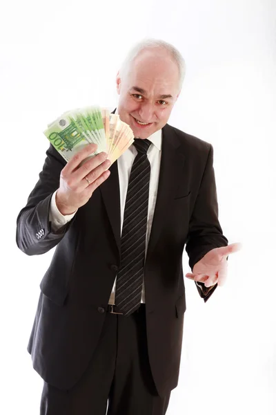Uomo con le banconote in euro in mano — Foto Stock