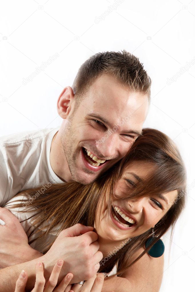 Happy young couple laughing together