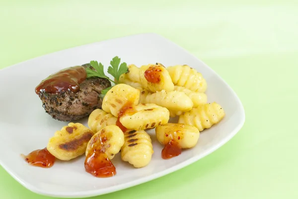 Pepper steak with gnocchi — Stock Photo, Image