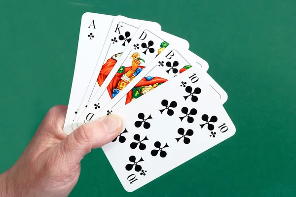 Royal flush in a hand — Stock Photo, Image