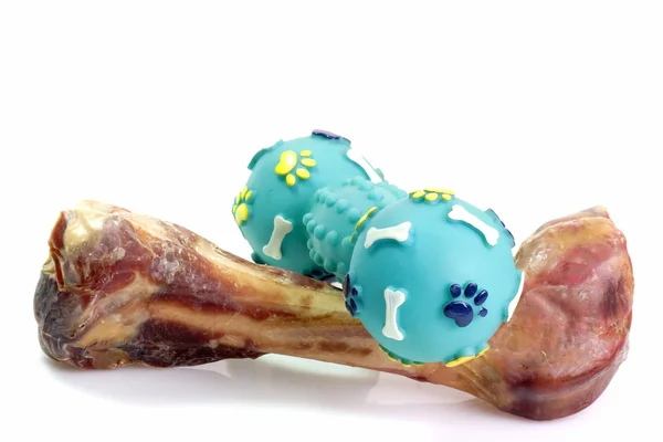 Tog bone with dog toy — Stock Photo, Image