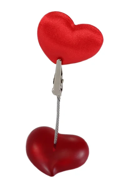 Clamp holding a velvet heart — Stock Photo, Image