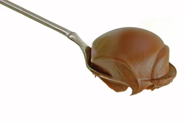 Spoon with chocolate cream — Stock Photo, Image