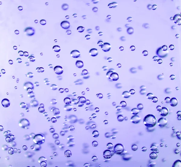 Очистити бульбашки в пурпуровому гелі — стокове фото