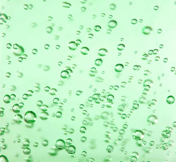 Klare Blasen in grünem Gel — Stockfoto