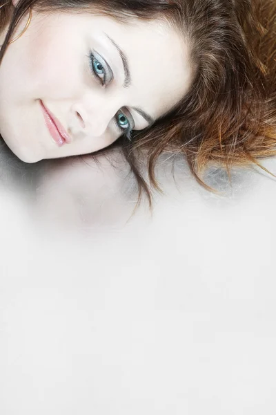 Woman's face on silver background — Stock Photo, Image