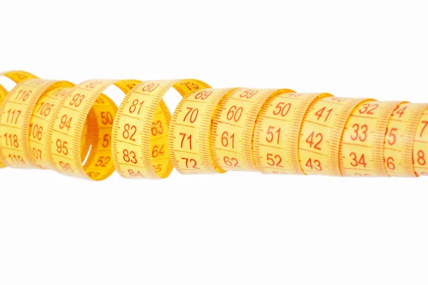 Yellow rolled measuring tape — Stock Photo, Image
