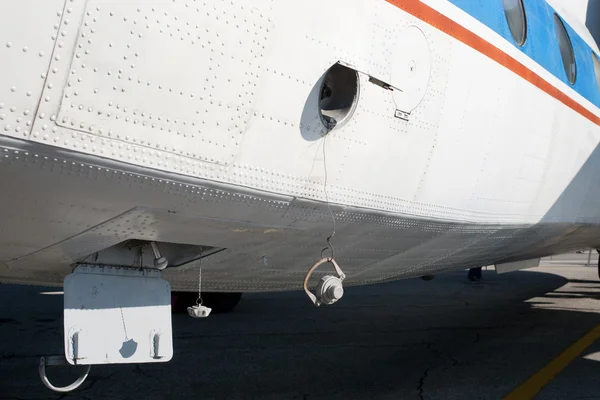Airplane fuselage with filling tank door cover — Stock Photo, Image