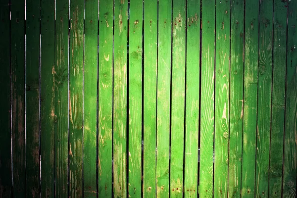 Green picket fence with light spot — Stock Photo, Image