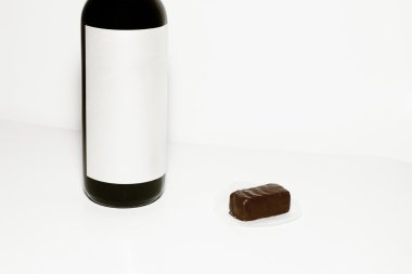 Wine bottle and chocolate candy clipart