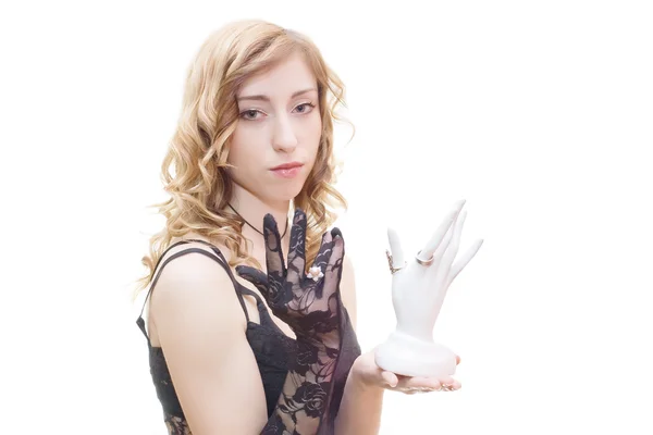 Blonde with black glove holding ring support — Stock Photo, Image