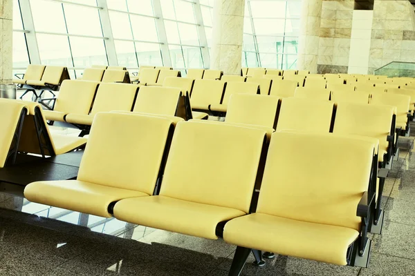 stock image Airport departure lounge with yellow chairs