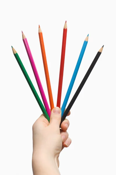 Рука держит цветные карандаши — стоковое фото