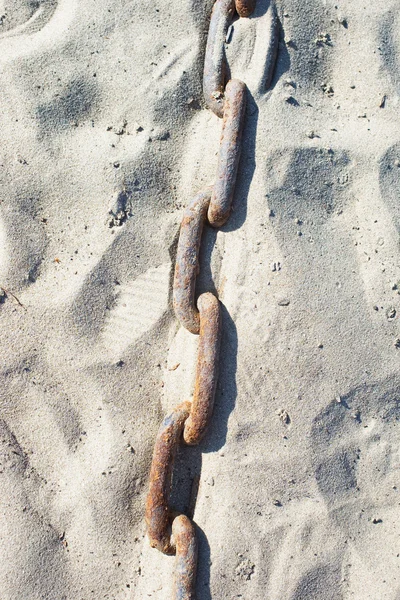 stock image Rusty chain in sand