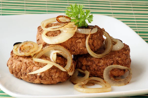 Rissole with grilled organic onion — Stock Photo, Image