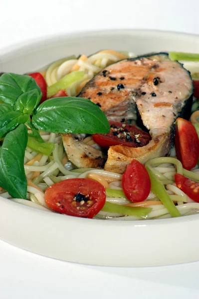 Grilled salmon fillet on pasta — Stock Photo, Image