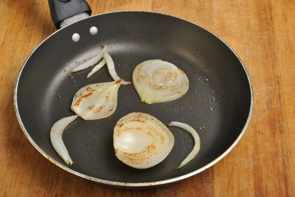 Organic onion with oil in a pan — Stock Photo, Image