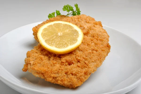 Breaded fish steak with organic herbs — Stock Photo, Image