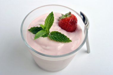 One organic strawberry in yogurt clipart