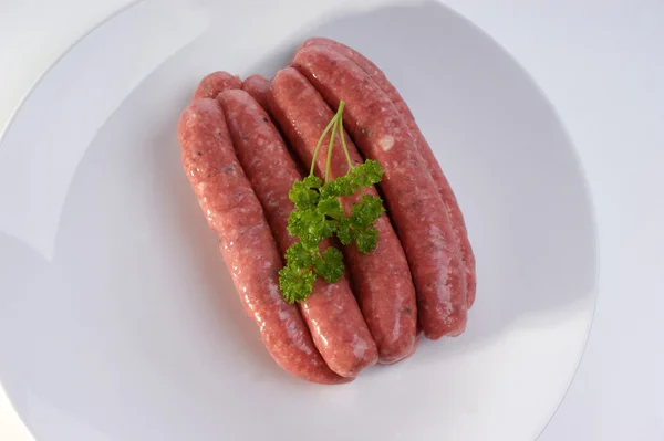 Some raw beef sausages — Stock Photo, Image