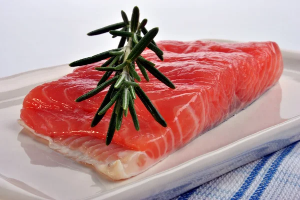 Salmon fillet with organic rosemary — Stock Photo, Image