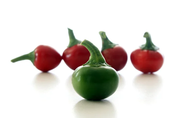 Green and red organic cherry paprika — Stock Photo, Image