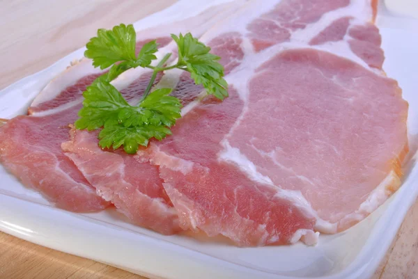Smoked bacon with organic parsley — Stock Photo, Image