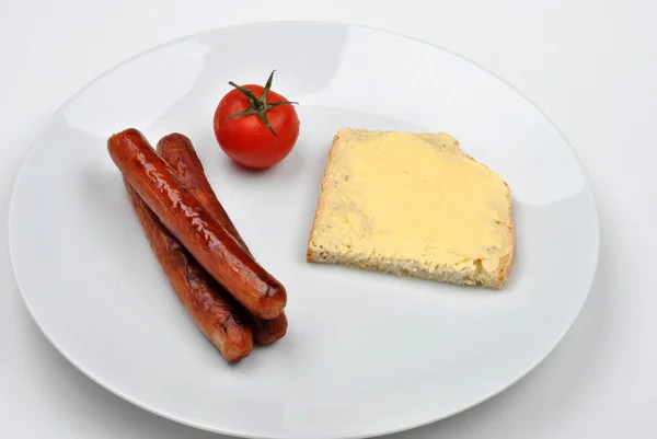 Копченая колбаса и помидоры — стоковое фото