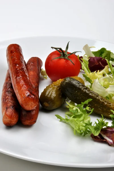 Smoked sausage and gherkin — Stock Photo, Image